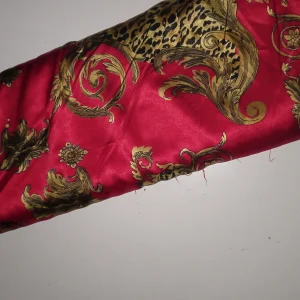 پارچه ساتن قرمز و طلایی